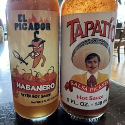 Bottled sauces on the tables Bottled sauces on the tables