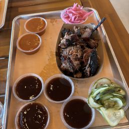 Pulled brisket, cucumbers and onions, all the bbq sauces Pulled brisket, cucumbers and onions, all the bbq sauces