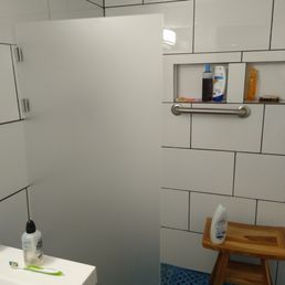 Frosted plexiglass for shower water barrier