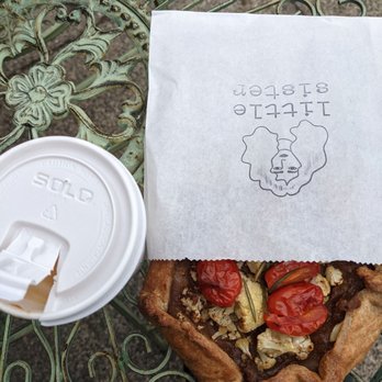 Little Sister - Savory galette on a charming outdoor table. - Breakfast & Brunch Near Me - Providence, Rhode Island Little Sister - Savory galette on a charming outdoor table. - Breakfast & Brunch Near Me - Providence, Rhode Island