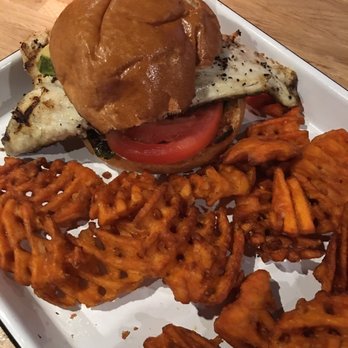 The Deck - Fish sandwich some delicious sweet potato fries - New American Near Me - Tybee Island, Georgia The Deck - Fish sandwich some delicious sweet potato fries - New American Near Me - Tybee Island, Georgia