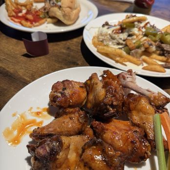 Rafael's Bistro - Front: Mango Habanero Wings, Middle: Texas Style Fries, Back: Cowboy Dog with fries. - Pizza Near Me - Glasgow, Kentucky Rafael's Bistro - Front: Mango Habanero Wings, Middle: Texas Style Fries, Back: Cowboy Dog with fries. - Pizza Near Me - Glasgow, Kentucky