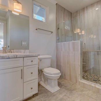 Wilson Construction - a bathroom with a walk in shower - General Contractors Near Me