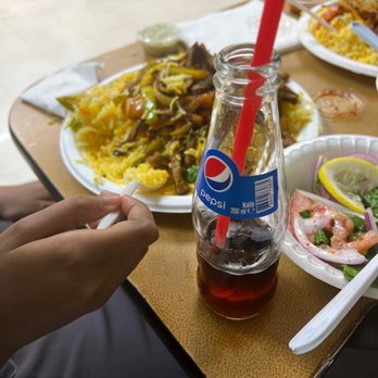 Nur Market & Restaurant - Eating rice with beef - Grocery Near Me - Tucson, Arizona