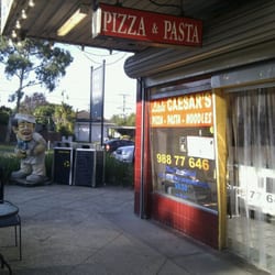Little Caeser's - Little Caesar's statue in front of the shop.