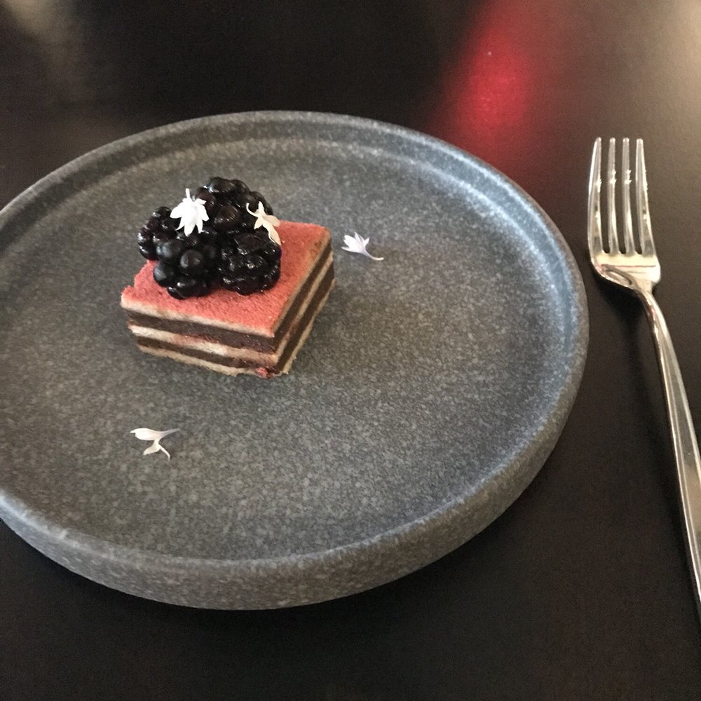 Beholder - Delicious bite of dessert (something with chocolate ganache but that's all I remember) brought out in celebration of our anniversary! - New American Near Me - Indianapolis, Indiana