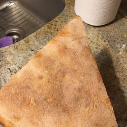 a hand holding a piece of bread a hand holding a piece of bread