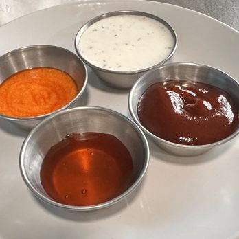 Elise’s Eatery - A sample of dipping sauces, sriracha , hot honey, ranch and bbq. - Burgers Near Me - Crescent City, California