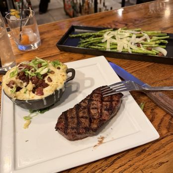 Sturbridge Porterhouse - The NY strip (tiny and too salty), loaded whipped potatoes (delicious), asparagus (perfectly el dente but too thin and again too salty). - American Near Me - Sturbridge, Massachusetts Sturbridge Porterhouse - The NY strip (tiny and too salty), loaded whipped potatoes (delicious), asparagus (perfectly el dente but too thin and again too salty). - American Near Me - Sturbridge, Massachusetts