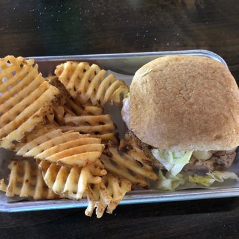 Bullet Grill House - Grilled chicken sandwich on sourdough and waffle fries. - Beer Bar Near Me - Point Blank, Texas Bullet Grill House - Grilled chicken sandwich on sourdough and waffle fries. - Beer Bar Near Me - Point Blank, Texas