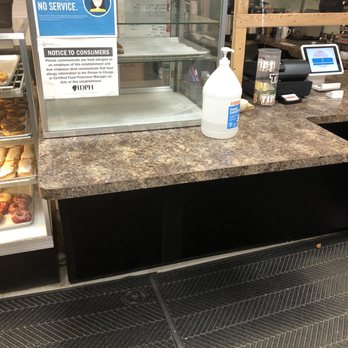 Gurnee Donuts - No mask no entry sign and hand sanitizer by the register - Donuts Near Me - Gurnee, Illinois