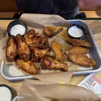 Buffalo Wild Wings - a tray of buffalo wings and dipping sauces - Sports Bars Near Me - Jensen Beach, Florida Buffalo Wild Wings - a tray of buffalo wings and dipping sauces - Sports Bars Near Me - Jensen Beach, Florida