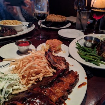 Glenwood's - Ribs and chicken signature dishes in the foreground, NY strip and chicken pot pie in the background. - American Near Me - Columbia, Maryland