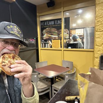 Einstein Bros. Bagels - Interior: excellent snacking site on premises of yours truly--please note:no (bike)gloves - Bagels Near Me - Houston, Texas