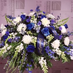 Carey's Cassville Florist - Beautiful blue and white tribute  spray