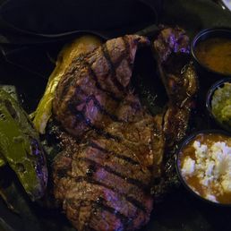 Carne Asada $28 with a tablespoon of beans and overcooked tortillas