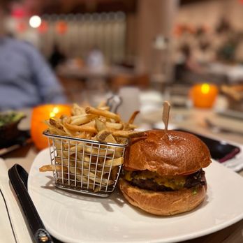 Carcara - a hamburger and french fries on a plate - Lounges Near Me - Phoenix, Arizona