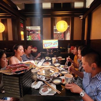 Chubby Cattle - 7 of us squeezed in a both for 4. One was at head table. We moved her to take photo. - Barbeque Near Me - Pleasanton, California
