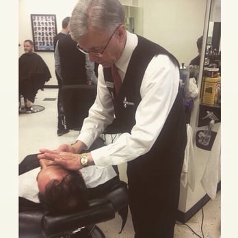 The Barber School - Milt.  Master instructor.  Instructing on a shave at the barber school.  They look that dapper every day. - Cosmetology Schools Near Me - Midvale, Utah