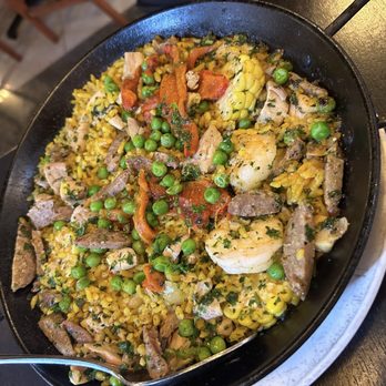 Oyo - Paella Oyo ( GF ) Chicken, pork sausage, shrimp, fresh corn ( like 3 tiny ones ) roasted bell peppers, peas, saffron, bomba rice - Latin American Near Me - Pleasanton, California Oyo - Paella Oyo ( GF ) Chicken, pork sausage, shrimp, fresh corn ( like 3 tiny ones ) roasted bell peppers, peas, saffron, bomba rice - Latin American Near Me - Pleasanton, California