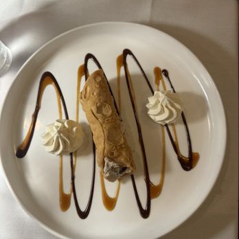 El toro steakhouse - Cannoli with whipped cream on the sides & a caramel & chocolate drizzle! Perfect balance of crunchy & creamy! - Steakhouses Near Me - Congers, New York El toro steakhouse - Cannoli with whipped cream on the sides & a caramel & chocolate drizzle! Perfect balance of crunchy & creamy! - Steakhouses Near Me - Congers, New York