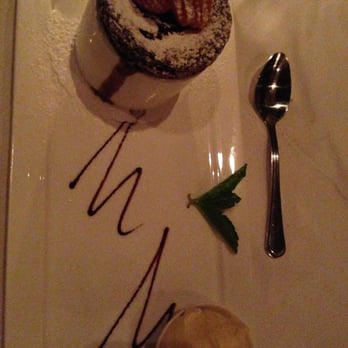 Basile - Fine Italian Kitchen - Chocolate soufflé with vanilla gelato - Italian Near Me - Boston, Massachusetts Basile - Fine Italian Kitchen - Chocolate soufflé with vanilla gelato - Italian Near Me - Boston, Massachusetts