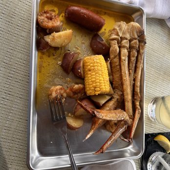 Latitude 26 - a tray of seafood and corn on the cob - Salad Near Me - Naples, Florida