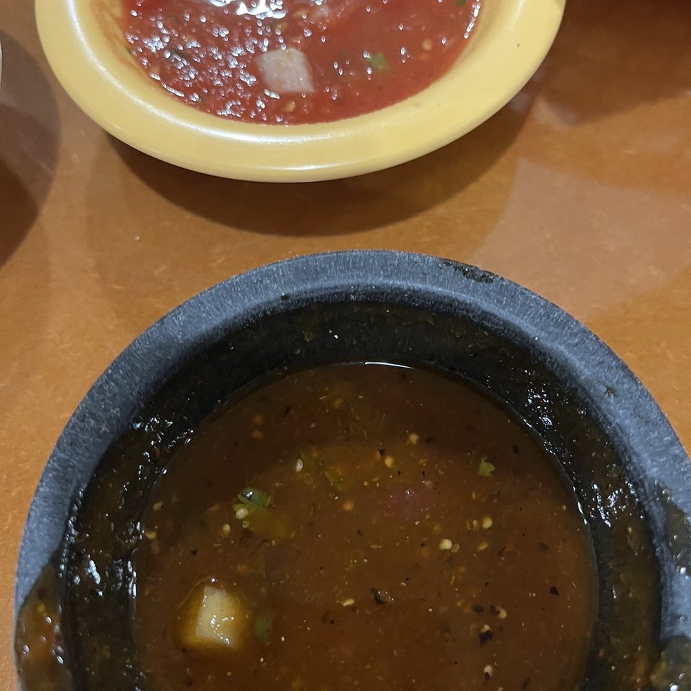 Mild is the bright red salsa and hot is the darker