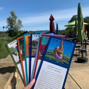 Lasseter Family Winery - a hand holding a bunch of cards - Wineries Near Me - Glen Ellen, California Lasseter Family Winery - a hand holding a bunch of cards - Wineries Near Me - Glen Ellen, California