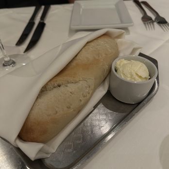 Ruth's Chris Steak House - This was a nice piece of hot sourdough bread with delicous butter - Steakhouses Near Me - Naperville, Illinois