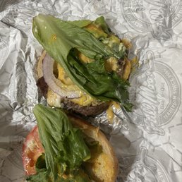 A tasteless burger with old lettuce A tasteless burger with old lettuce