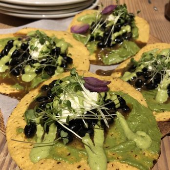 Lechon - Black bean and burrata tostadas with aji verde - Tapas Bars Near Me - Portland, Oregon Lechon - Black bean and burrata tostadas with aji verde - Tapas Bars Near Me - Portland, Oregon