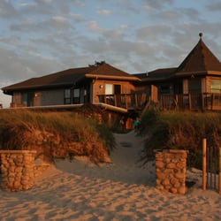 Linger Longer by the Sea Apts & Cottages - The Apartment building at sunset.