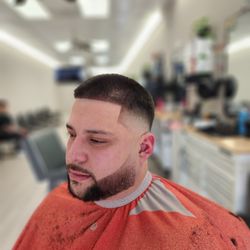 The Genuine Barbershop - Drop fade with #5 on top and a beard trim and line up