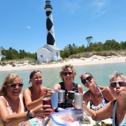 H2O Captain Eco-Tour Private Boat Excursions - Ladies Day out with lunch on the H2O Captain Dining Table in front of the iconic Cape Lookout Lighthouse.