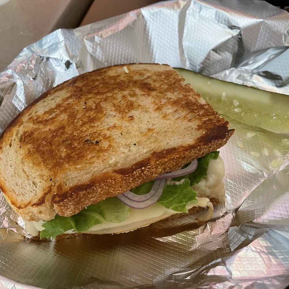 NeWorlDeli - Grilled turkey and gruyere "more than half" sandwich - Delis Near Me - Austin, Texas NeWorlDeli - Grilled turkey and gruyere "more than half" sandwich - Delis Near Me - Austin, Texas