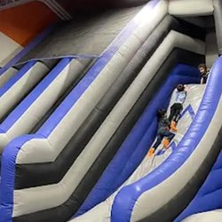 Inflatables - Enjoy nonstop fun on our inflatable court! Run, jump, and bounce through exciting obstacles while racing to bea...