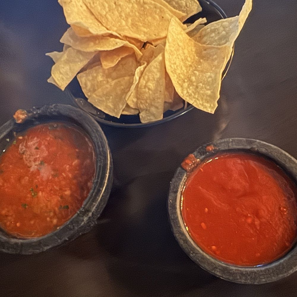 Manuel's Mexican Restaurant - Complimentary chips & salsa. The menu indicates they're $7.50 but this was brought ahead of ordering. Mild on left, "hot" on right. - Mexican Near Me - Phoenix, Arizona Manuel's Mexican Restaurant - Complimentary chips & salsa. The menu indicates they're $7.50 but this was brought ahead of ordering. Mild on left, "hot" on right. - Mexican Near Me - Phoenix, Arizona