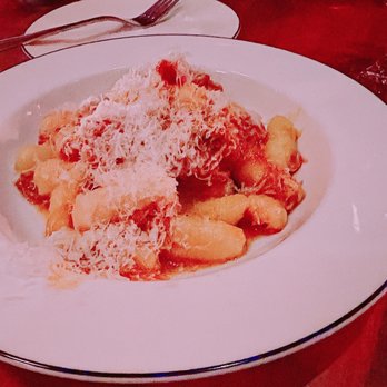 Casa Paco - a plate of pasta with sauce and parmesan cheese - Spanish Near Me - Toronto, Ontario Casa Paco - a plate of pasta with sauce and parmesan cheese - Spanish Near Me - Toronto, Ontario