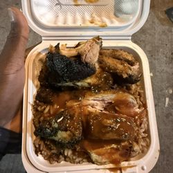 Hot Pot Restaurant - Small Jerk Chicken with a piece of pork.