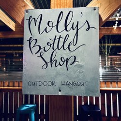 Molly's Bottle Shop - Cute sign on the covered outdoor seating