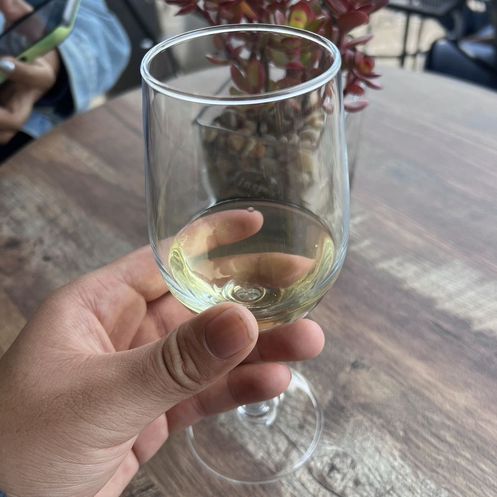 Alamitos Vineyards - Beautiful white wine cup and furniture. Heaters nearby so you can come rain or shine. - Wine Tasting Room Near Me - San Jose, California