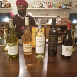 Maninder serving wine samples at the monthly - Wednesday Wine Tasting and buffet night. Maninder serving wine samples at the monthly - Wednesday Wine Tasting and buffet night.