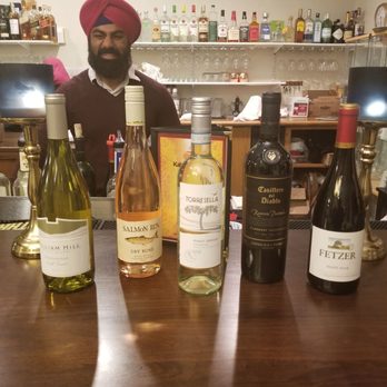 Kabab & Curry - Maninder serving wine samples at the monthly - Wednesday Wine Tasting and buffet night. - Indian Near Me - Williamsville, New York Kabab & Curry - Maninder serving wine samples at the monthly - Wednesday Wine Tasting and buffet night. - Indian Near Me - Williamsville, New York