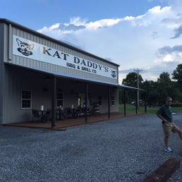 a man standing in front of a building a man standing in front of a building