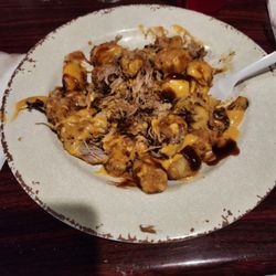 The Outlaw Bar & Grill - Hot Mess Tots. Tater Tots topped with pulled pork, nacho cheese, and BBQ sauce. I had them hold the jalapeños though.
