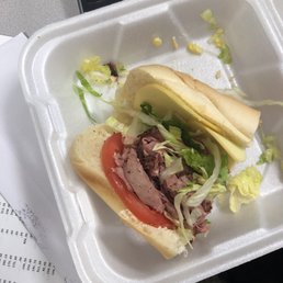 a sandwich in a styrofoam container