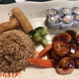 The Special Box with spring rolls, shrimp teriyaki, fried rice, and the East Roll