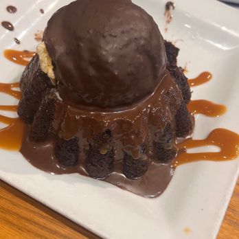 Chili's - Lava brownie cake soft moist and warm covered in Carmel sauce. Scoop of vanilla bean ice cream and magic shell on top - Tex-Mex Near Me - Riverside, California Chili's - Lava brownie cake soft moist and warm covered in Carmel sauce. Scoop of vanilla bean ice cream and magic shell on top - Tex-Mex Near Me - Riverside, California