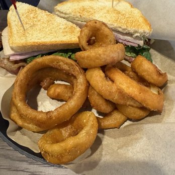 The 303 Sports Grill - Club sandwich with onion rings. - Sports Bars Near Me - Lone Tree, Colorado The 303 Sports Grill - Club sandwich with onion rings. - Sports Bars Near Me - Lone Tree, Colorado